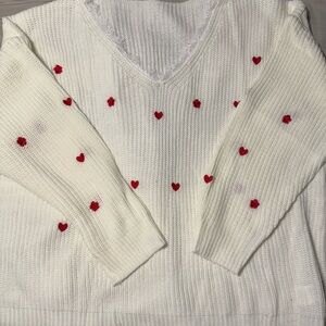 Cozy White and Red Crew Neck Sweater with Decorative Accents
